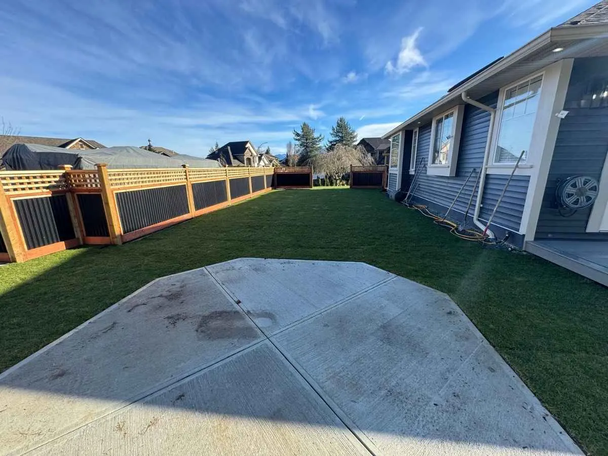 A finished patio surface meeting a lawn edge