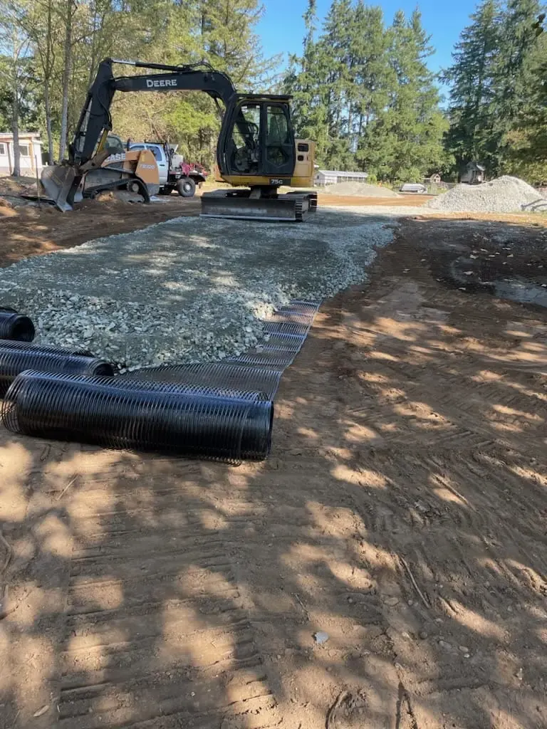 Drain rock and pipe going into a trench