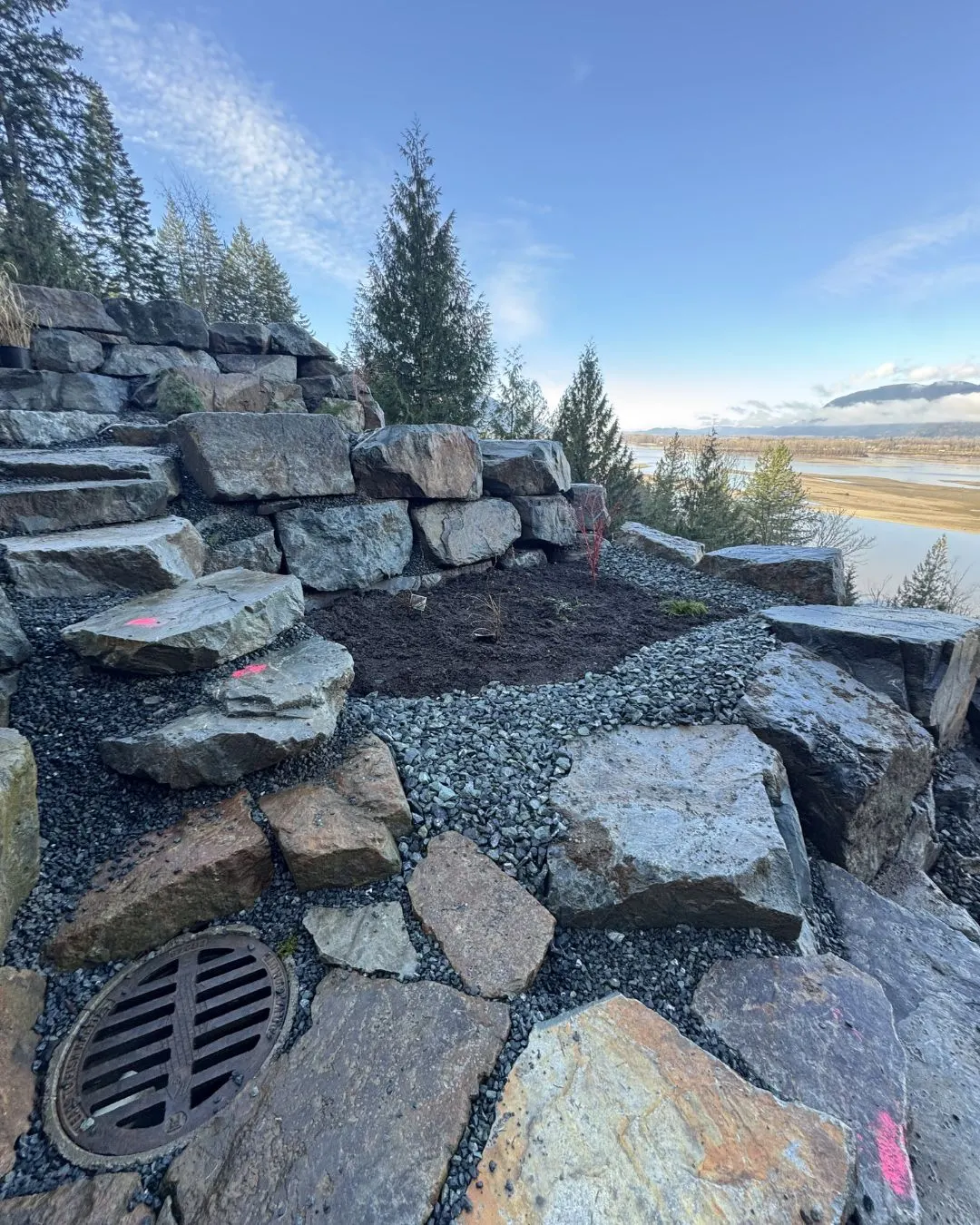 A drain grate at the base of a finished wall