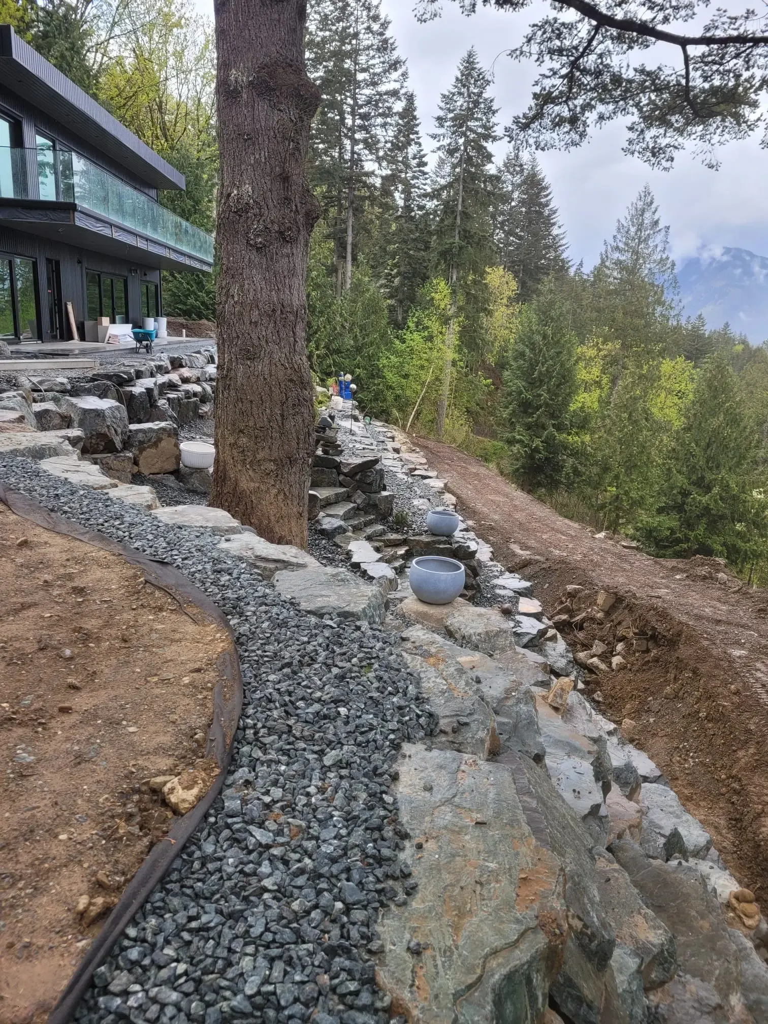 A gravel path running alongside a finished rock wall