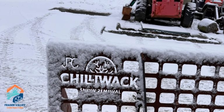 Image of Chilliwack Snow Removal snow plow with their logo engraved on the bucket